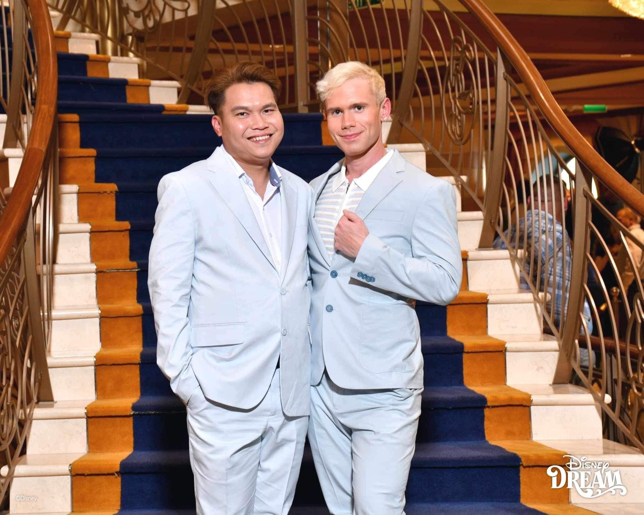 Photo of Me and My husband dressed up on the Disney Dream Cruise Ship Stairs